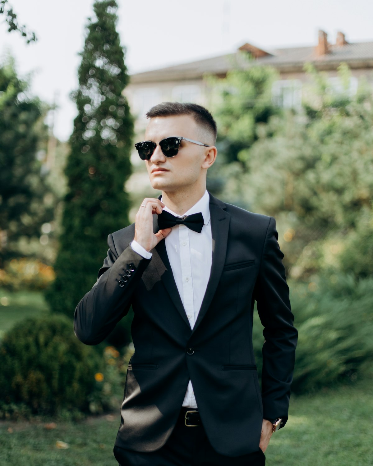 Groom in a black tuxedo with bow tie