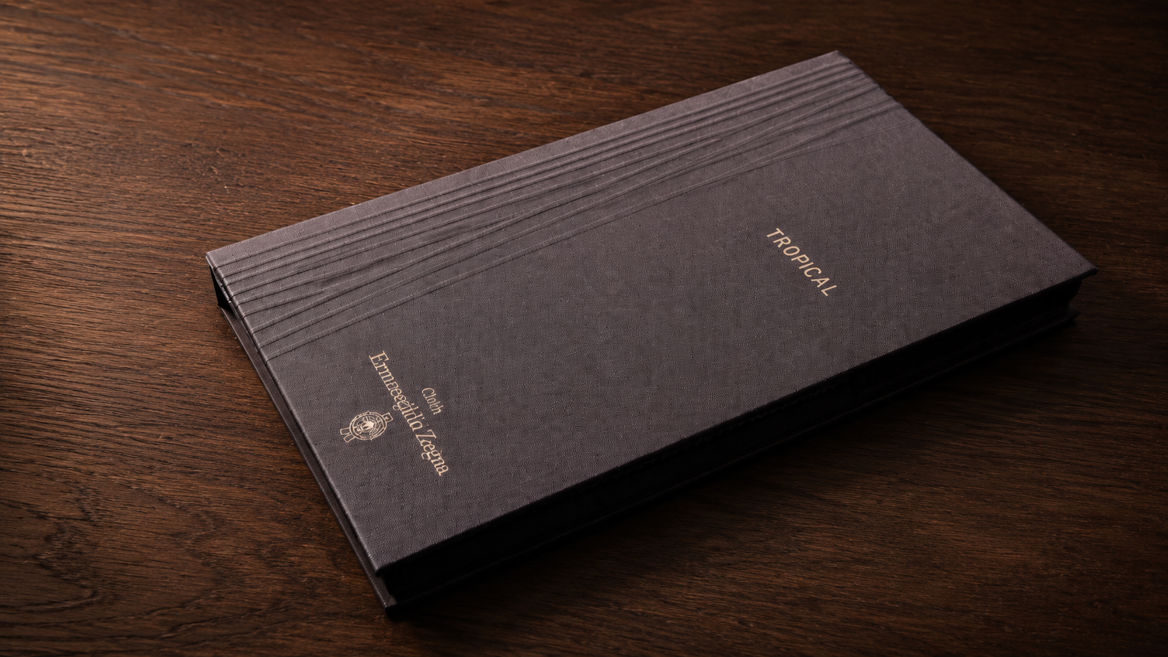 Ermenegildo Zegna Tropical 261 fabric sample book on a wooden table