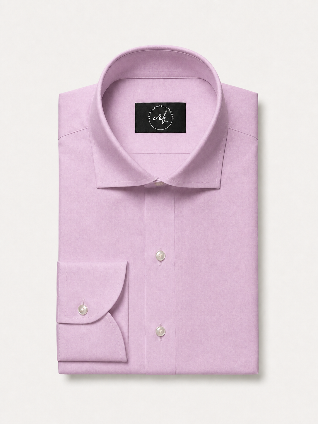Pink solid non-iron cotton shirt, folded