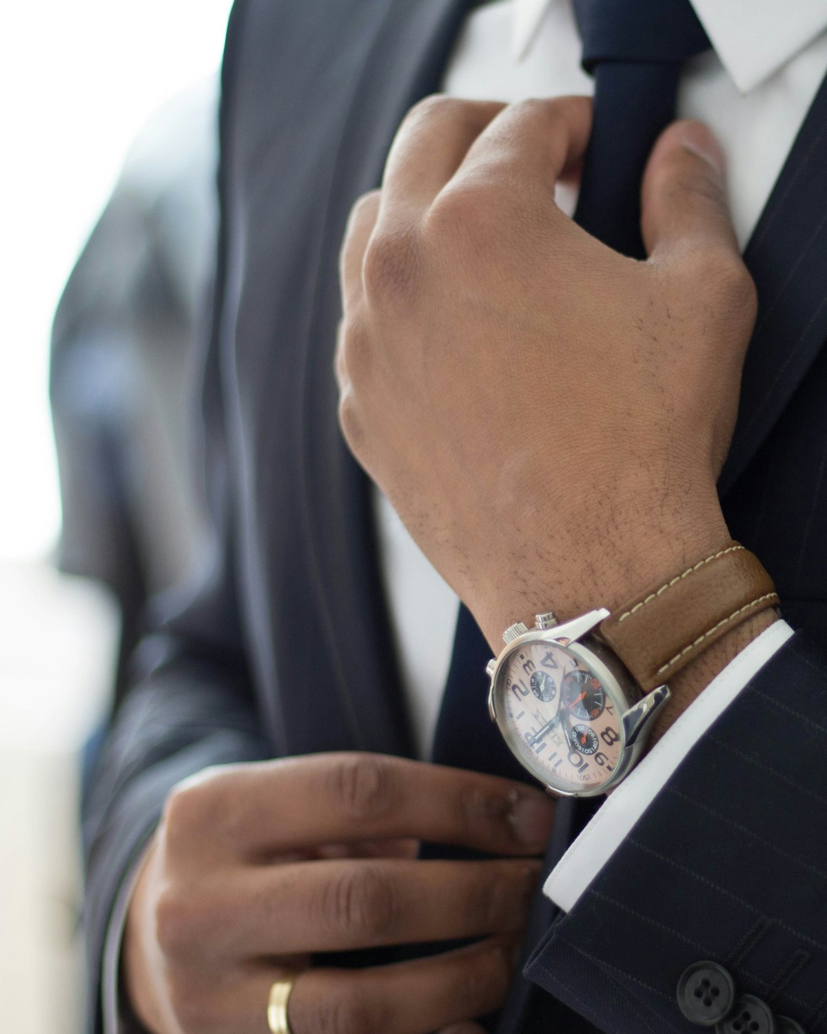 Navy pinstripe suit and tie